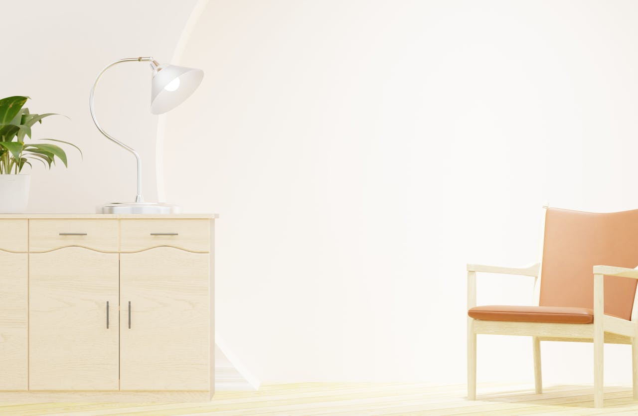 Modern minimalist interior with wooden furniture, a lamp, and a plant.